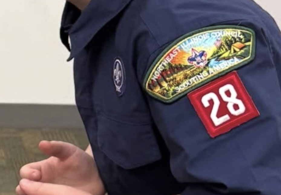 Blue shirt with the Northeast Illinois Council patch and numerals 28